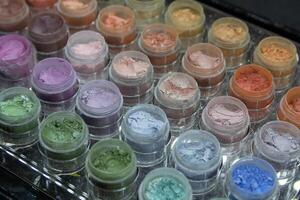 Variety Mineral eyelid pigments palettes on a store window photo