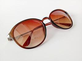Brown Sunglasses isolated white background photo