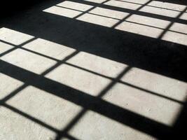 Window shade in a room with dark nuances. photo