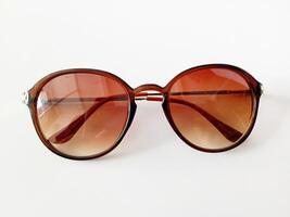 Brown sunglasses isolated white background. photo
