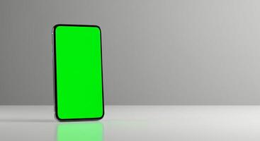 A green screen on a smartphone with a gray background photo