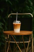 Iced latte on outdoor table photo