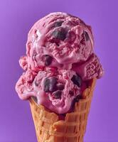 Berry ice cream in waffle cone photo