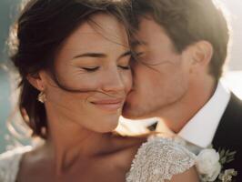Realistic photo in film style. Groom gently kisses bride on the cheek as she stands with closed eyes and a serene smile. Her dress sparkles with sequins, her hair is styled