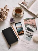 A cozy flat lay scene on a white desk photo