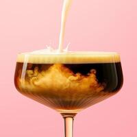 A low cocktail glass with a stem filled with dark coffee liqueur, as thick cream is poured into it from above. photo