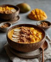 Tropical mango banana smoothie bowl photo