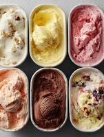 Assorted ice cream tubs top view photo