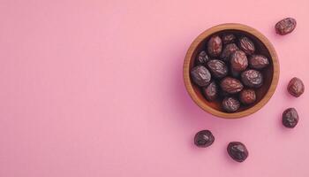 Dates fruit fresh organic on wooden bowl copy space background and some decoration photo