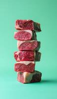 Arranged stack fresh beef slices un cook in blue story vertical background photo