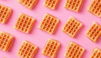 Chocolate square waffle pattern seamless flat lay view on pink background photo