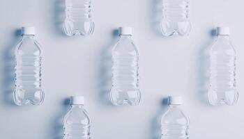 Empty transparent plastic bottle drink mineral water container white background photo