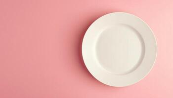 Empty blank mockup ceramic white plate on solid pink background for display food photo