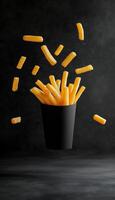 Potato stick fries floating on air with black vertical background photo