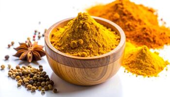 Turmeric Spice in Wooden Bowl with Anise and Pepper photo
