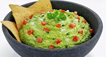 Overhead View of Authentic Fresh Avocado Guacamole in a Textured Charcoal Bowl photo