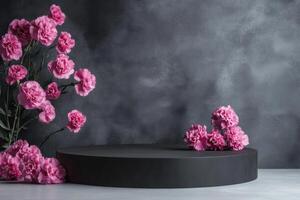 pink carnations on a black round table photo