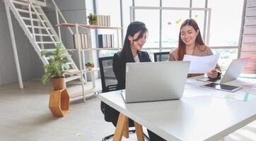 Collaborative Meeting in Modern Office Space, Business Women Discussing Ideas in Office Space, Teamwork and Brainstorming Concept with Businesswomen in Office Meeting photo