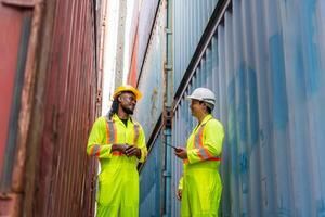 Engineer man Team in Safety Gear Control Containers Box at Container Cargo, Dock Worker Inspecting Containers Boxes at Industrial Site photo