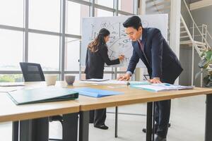 Businesspeople meeting in modern office, Professional business meeting in office environment, Teamwork and brainstorming concepts photo