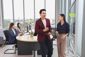Asian business people team meeting in office, Professional business meeting in office, Teamwork and brainstorming concepts photo