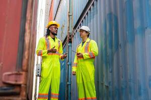 Engineer Man Team in Safety Gear Control Loading Containers Box at Industrial Site, Foreman Dock Worker Inspecting Containers Boxes at Container Cargo photo