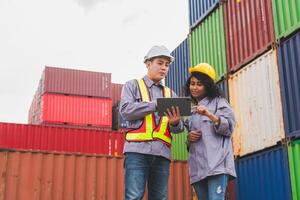 Engineer Foreman Team in Safety Gear Inspecting Containers Box at Industrial Site, Container Yard Dock Workers Discussion at Shipping Yard photo
