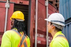 Foreman Dock Worker Team Inspecting Containers Boxes at Industrial Site photo