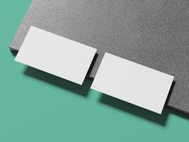 Clean and minimalistic white business cards placed side by side on a sophisticated marble background. photo