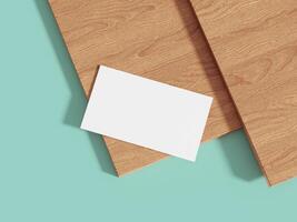 A clean and minimalistic business card mockup on a wooden surface with a light blue background, perfect for showcasing professional branding designs. photo