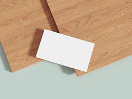 Business card mockup placed on a wooden surface with soft lighting, offering a neutral, elegant look for presenting modern brand identity. photo