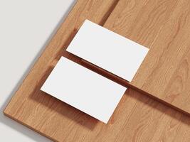 Business card mockup resting on a wooden surface with subtle shadows, ideal for minimalistic branding presentations. photo