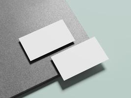 Simple white business cards laid on a refined marble background, showcasing an understated, sophisticated design. photo