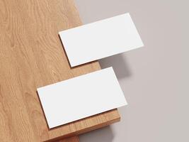 Business card mockup placed on a textured wooden surface with soft lighting, offering a professional backdrop for clean, modern designs. photo