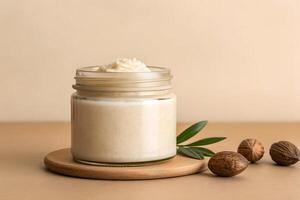 Jar with Shea Butter and Nuts Isolated photo