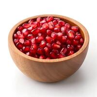 Ruby Red Pomegranate Seeds in Rustic Bowl on White photo