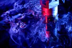 machine working on liquid with blue illumination photo