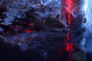 machine working on liquid with red and blue illumination photo