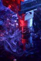 vertical view of the machine working on liquid with blue and red illumination photo