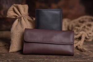 Elegant leather wallets displayed on rustic wooden surface with burlap sack photo