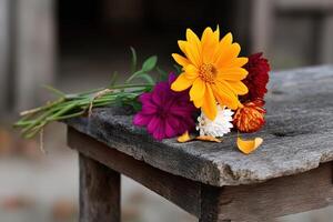 Vibrant bouquet of wildflowers resting on rustic wooden table in natural setting photo