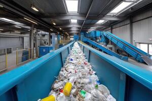 Recycling facility in action with a conveyor belt transporting plastic waste materials photo