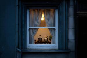 Cozy kitchen illuminated at night in a residential building photo