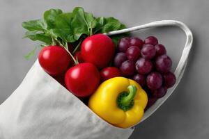 Fresh vegetables and fruits in a reusable bag ready for a healthy meal preparation photo