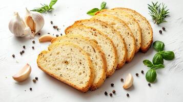 Sliced bread with garlic and herbs on a white background photo