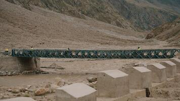 Motorbikes Crossing Bridge in Remote Valley video
