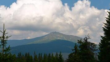 Time lapse of Clouds move over mountains in Carpathian mountains. 4K video