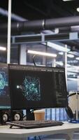 Vertical AI development workstation in data center with dual monitors displaying machine learning code. Server hub computers used for tracking neural network structures algorithm performance video