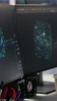 Vertical Data center PCs showing neural network visualization and code debugging tools running. Computer systems in server farm powering machine learning and automated research tasks video