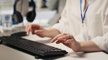 Software developer monitors server clusters performing AI training and inference tasks. IT expert supervising high tech computing systems managing machine learning storage operations, camera A closeup video